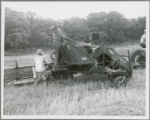 McCormick-Deering harvester pulled by tractor