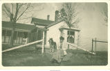 Marie Knickerbocker and dog on Barr farm, Olin, Iowa, 1910s