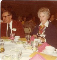 Mr. and Mrs. Robert Boatman sit at a conference dinner