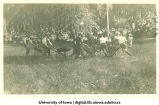 Wheelbarrow race at City Park for Senior Frolic, The University of Iowa, 1910s