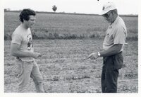 1978 Two men look at pipe