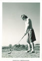 Lining up a golf ball for a drive, The University of Iowa, 1930s