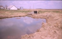 Water control structure near farmhouse