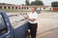 Community Conservation Volunteer, Janet Lindsay, assists in the Quad Community Awards.