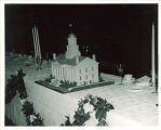 Old Capitol model on a festive table for the 100th anniversary of the Old Capitol party, The University of Iowa, 1947
