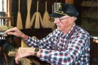Harry Leonhardt, broommaker at the West Amana Broom and Basket Shop, West Amana, Iowa, November 2003