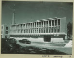 Automobiles by new Communications Center on Madison Street, The University of Iowa, July 1953