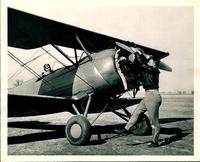 0028_Norman Van Grop, Flight Instructor Spinning the Propellor
