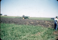 Moldboard plows a meadow.
