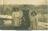 Four sisters (?) posing outside, Edgewood (?), Iowa, 1910s