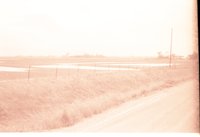 Fenced farmland with Water in the Field