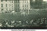 Women dancing with large scarves near a maypole on the Pentacrest lawn, The University of Iowa, June 1924