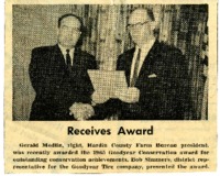 Gerald Modlin receives award. 