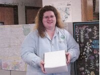 Staff holding doughnuts