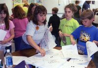 Students make pine cone bird feeders
