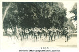 Marching band performing during commencement week, The University of Iowa, June, 1919