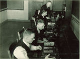 Physics students working with mechanical calculators, The University of Iowa, 1930s