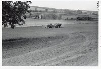 1978 Man on tractor with wagon plants seed