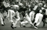 ISU quarterback tossing the ball during the Homecoming Game, 1985