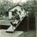 Children playing on wood platforms and slides, The University of Iowa, May 28, 1941