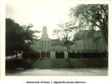 Commencement procession on west side of Pentacrest with Madison Street in foreground, The University of Iowa, June 1929