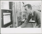Researcher checks a monitor