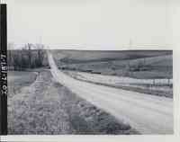 Unidentified country road surrounded by farmland