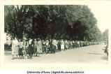 Procession of women walking south on Clinton St., The University of Iowa, 1920s