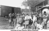 Cadets loading gear onto train car to Camp Macbride, The University of Iowa, 1914