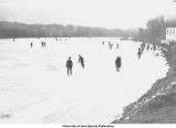 Ice skaters on Iowa River, Iowa City, Iowa, ca. 1920
