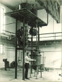 Men using large machine in a chemistry department machine shop, The University of Iowa, 1930s