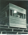 Carl Menzer broadcasting from press box at Iowa Stadium, The University of Iowa, 1920s