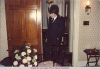 John, Jr. in door way of living room looking down