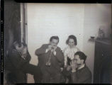 Members of The Society for the Prevention of Cruelty to Speakers playing harmonicas, The University of Iowa, 1935