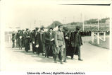 Cadet leading commencement procession, The University of Iowa, 1910s