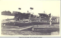 Unknown men loading cars onto a ferry