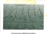 Marching band performing at football game, The University of Iowa, 1940s