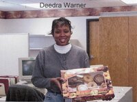 Staff holding doughnuts