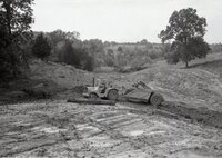 1970s Earthmoving machinery in field