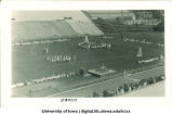 Children dancing with May poles in a stadium, The University of Iowa, 1920s