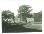 Cars parked by Field House, the University of Iowa, 1920s?
