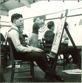 Art student gazing at painting, The University of Iowa, 1940s