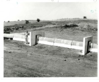 Jay Ford Stands in Front of Prin Spillway Pipe