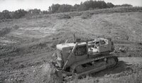 1970s Earthmoving machinery in field