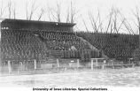 Battery D cadet corps in bleachers with military band, Iowa Field, The University of Iowa, 1918