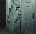 Stack of boxes outside a store room, The University of Iowa, 1930s?