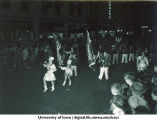 Marching band in Homecoming parade, The University of Iowa, 1940s