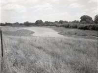 Stream runs through grasslands