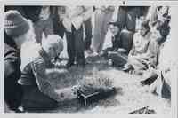 Kneeling Instructor Holding Jar