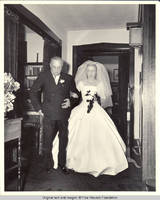 Bill and Frindy Burden in entry hall on Frindy's wedding day